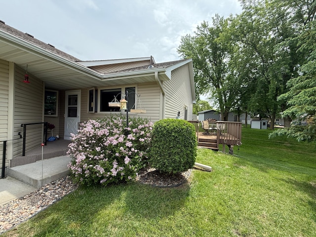 1508 Terrance Cir NE, New Prague, MN 56071 - view of home's exterior featuring a lawn and a wooden deck