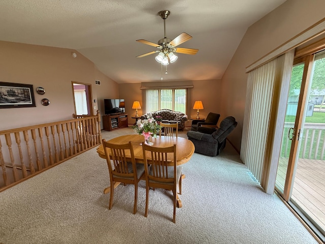 1508 Terrance Cir NE, New Prague, MN 56071 - carpeted dining space with lofted ceiling, plenty of natural light, and ceiling fan
