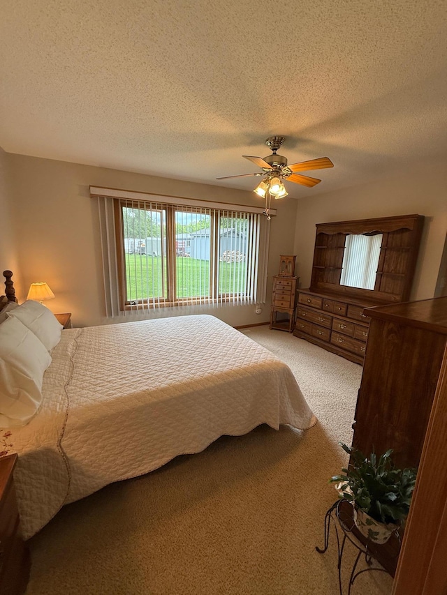 1508 Terrance Cir NE, New Prague, MN 56071 - bedroom with multiple windows, light colored carpet, a textured ceiling, and ceiling fan