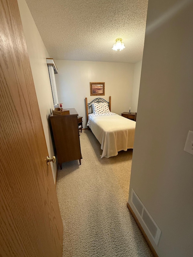 1508 Terrance Cir NE, New Prague, MN 56071 - bedroom with light colored carpet and a textured ceiling