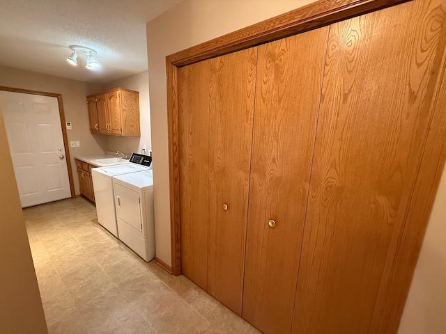 1508 Terrance Cir NE, New Prague, MN 56071 - washroom with cabinet space, washing machine and clothes dryer, and a textured ceiling
