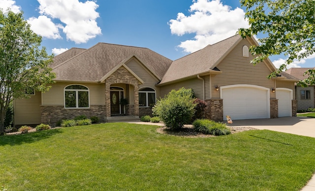 3262 Jade Ct NE, Rochester, MN 55906 - view of front facade featuring a garage, brick siding, concrete driveway, and a front yard