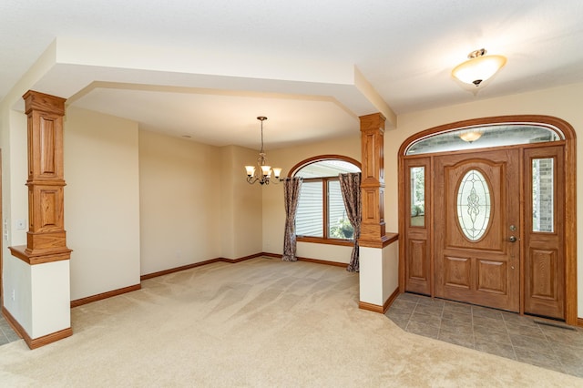 3262 Jade Ct NE, Rochester, MN 55906 - entryway with light carpet, a chandelier, and ornate columns