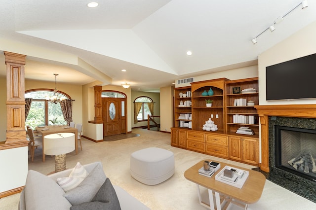 3262 Jade Ct NE, Rochester, MN 55906 - living room with vaulted ceiling, a chandelier, recessed lighting, a fireplace, and light colored carpet