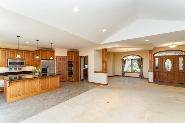 3262 Jade Ct NE, Rochester, MN 55906 - kitchen with stainless steel appliances, recessed lighting, vaulted ceiling, brown cabinetry, and open floor plan