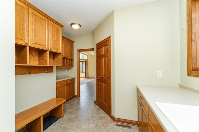 3262 Jade Ct NE, Rochester, MN 55906 - mudroom featuring a sink and light tile patterned floors