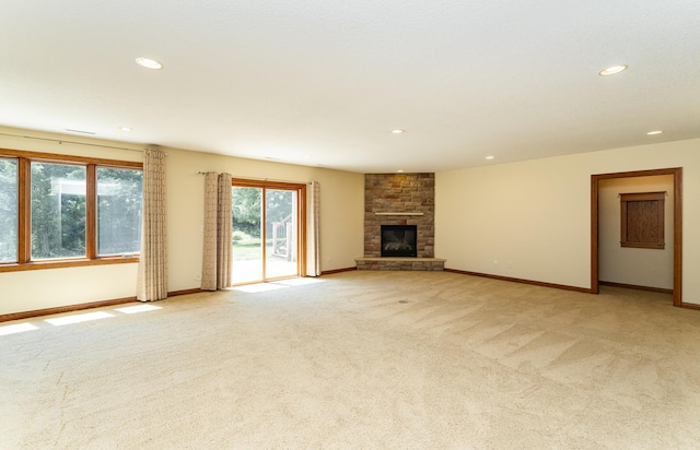 3262 Jade Ct NE, Rochester, MN 55906 - unfurnished living room with light colored carpet, recessed lighting, and a large fireplace