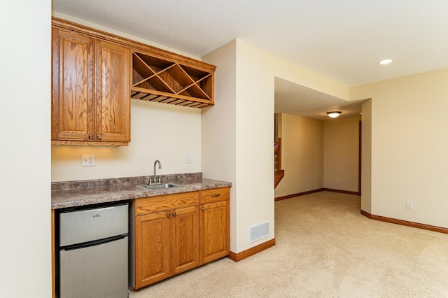 3262 Jade Ct NE, Rochester, MN 55906 - indoor wet bar featuring refrigerator, light colored carpet, and recessed lighting