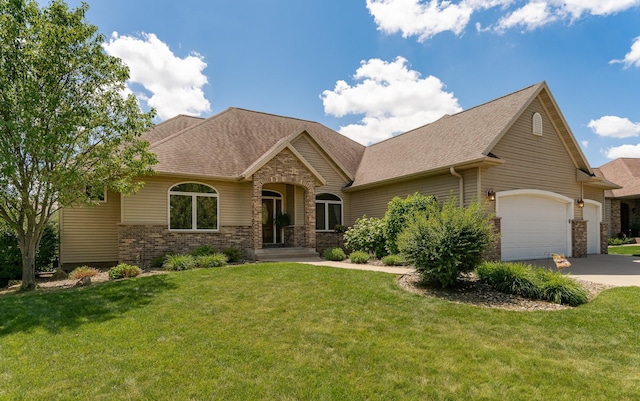 3262 Jade Ct NE, Rochester, MN 55906 - view of front of house featuring an attached garage, driveway, a front lawn, and brick siding