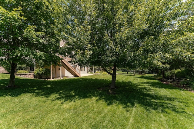 3262 Jade Ct NE, Rochester, MN 55906 - view of grassy yard featuring stairs