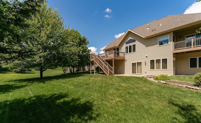 3262 Jade Ct NE, Rochester, MN 55906 - back of property with stairs, a deck, and a lawn