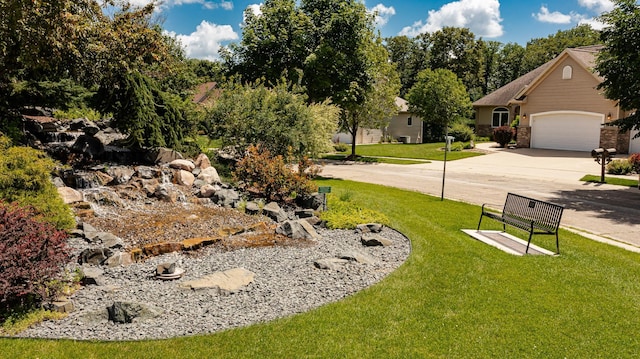 3262 Jade Ct NE, Rochester, MN 55906 - view of green lawn featuring concrete driveway and a garage
