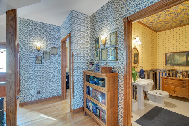 19319 380th St, Erhards Grove Twp, MN 56534 - bathroom featuring wallpapered walls and wood finished floors