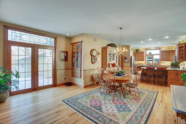 19319 380th St, Erhards Grove Twp, MN 56534 - dining area featuring a chandelier, light wood-style floors, and recessed lighting