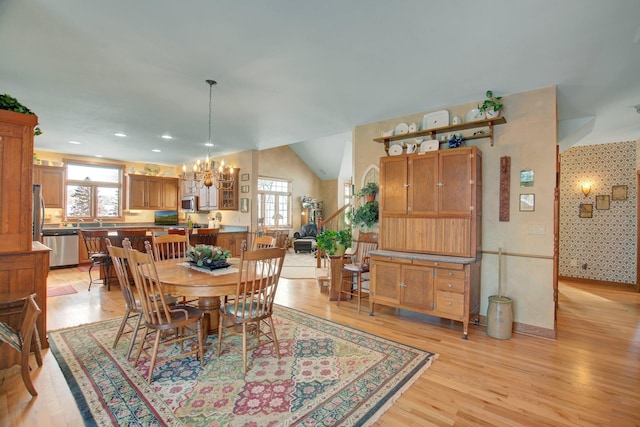 19319 380th St, Erhards Grove Twp, MN 56534 - dining room with a chandelier, light wood-type flooring, wallpapered walls, and lofted ceiling