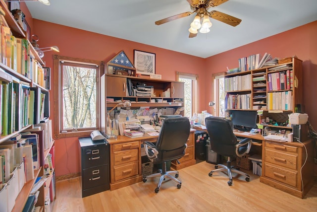 19319 380th St, Erhards Grove Twp, MN 56534 - office area featuring light wood-style flooring and a ceiling fan