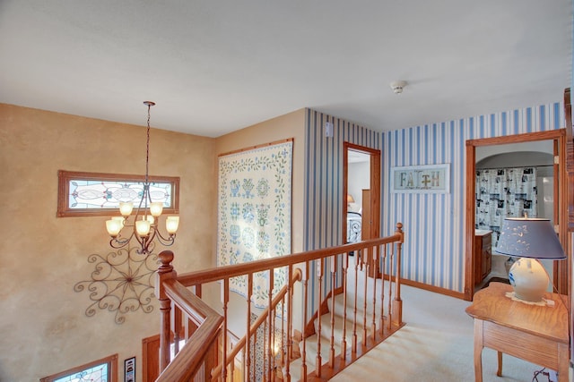 19319 380th St, Erhards Grove Twp, MN 56534 - hall featuring an upstairs landing, a chandelier, carpet, and wallpapered walls