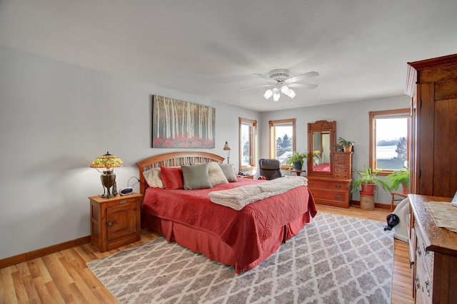 19319 380th St, Erhards Grove Twp, MN 56534 - bedroom featuring light wood-style flooring and ceiling fan
