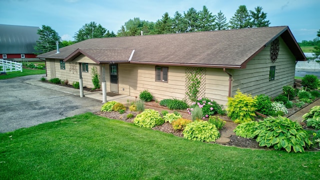 19319 380th St, Erhards Grove Twp, MN 56534 - ranch-style home featuring roof with shingles and a front lawn