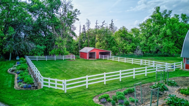 19319 380th St, Erhards Grove Twp, MN 56534 - view of yard with a pole building, an outdoor structure, a vegetable garden, and a garage