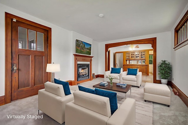 1196 Minnehaha Ave E, Saint Paul, MN 55106 - living room with carpet flooring and a warm lit fireplace