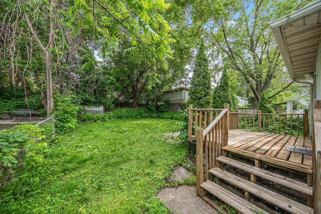 1196 Minnehaha Ave E, Saint Paul, MN 55106 - view of green lawn featuring a wooden deck