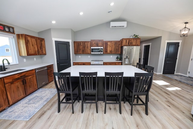2060 Rosewood Ln SE, Alexandria, MN 56308 - kitchen featuring stainless steel appliances, a wall mounted air conditioner, light wood finished floors, light countertops, and vaulted ceiling