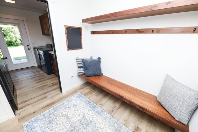 2060 Rosewood Ln SE, Alexandria, MN 56308 - mudroom featuring washing machine and dryer and light wood-type flooring