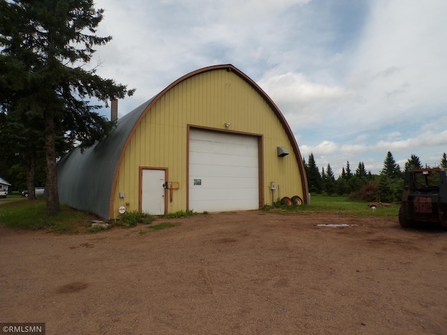 45248 State Highway 48, Clover Twp, MN 55037 - detached garage with dirt driveway