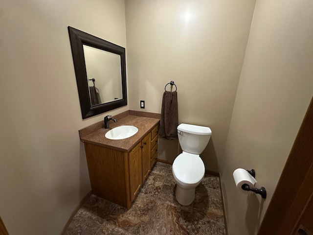 1702 15th St SW, Willmar, MN 56201 - bathroom featuring vanity and stone finish floors
