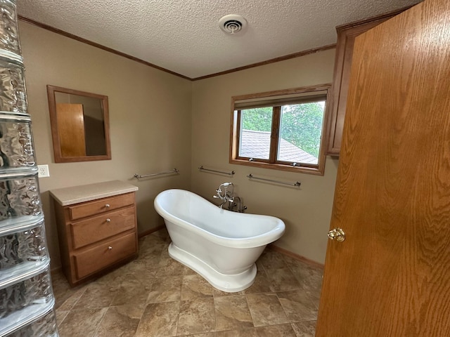 1702 15th St SW, Willmar, MN 56201 - bathroom featuring crown molding, a freestanding tub, and a textured ceiling