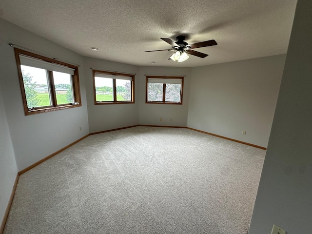 1702 15th St SW, Willmar, MN 56201 - spare room featuring light colored carpet, a ceiling fan, and a textured ceiling