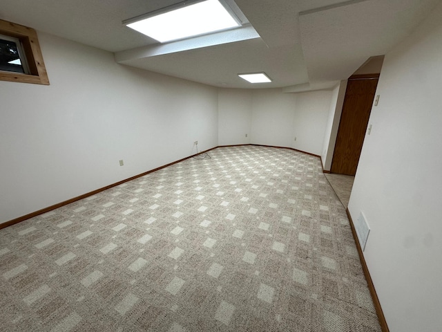 1702 15th St SW, Willmar, MN 56201 - finished below grade area featuring carpet and baseboards