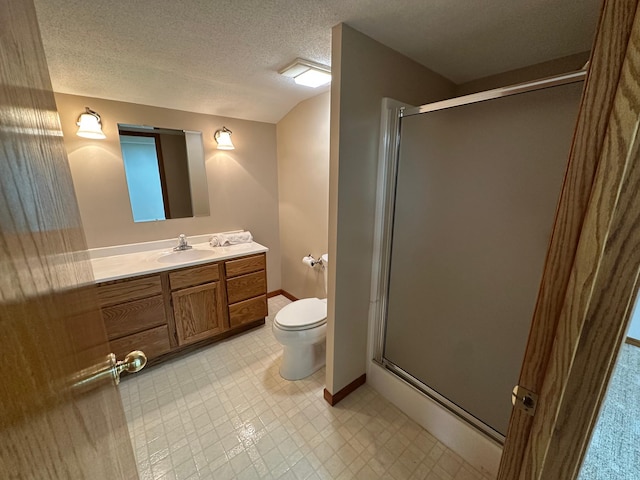 1702 15th St SW, Willmar, MN 56201 - full bathroom with a stall shower, vanity, a textured ceiling, and tile patterned floors