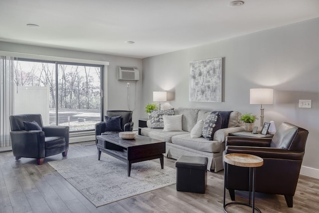10501 Cedar Lake Rd Unit 217, Minnetonka, MN 55305 - living room with an AC wall unit and wood finished floors