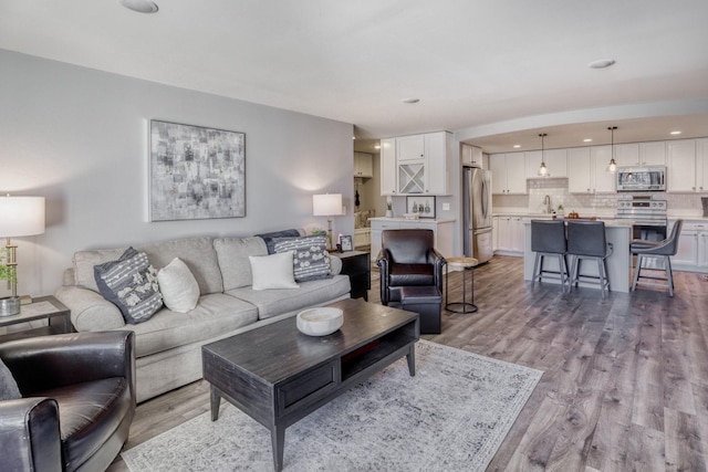 10501 Cedar Lake Rd Unit 217, Minnetonka, MN 55305 - living room featuring wood finished floors and recessed lighting
