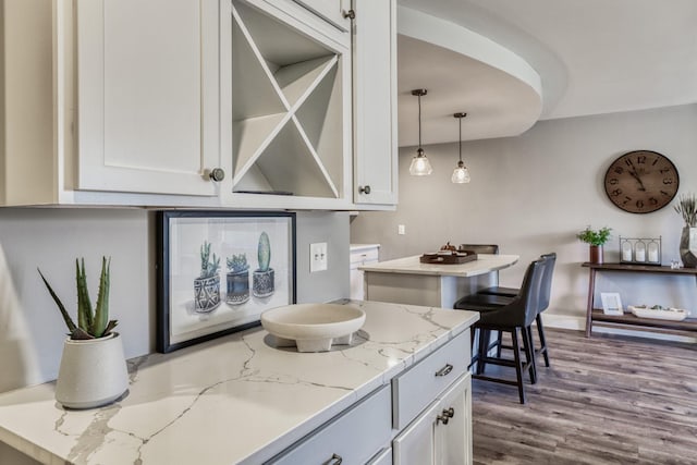 10501 Cedar Lake Rd Unit 217, Minnetonka, MN 55305 - bar area featuring wood finished floors and decorative light fixtures