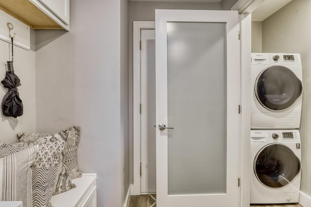 10501 Cedar Lake Rd Unit 217, Minnetonka, MN 55305 - washroom featuring estacked washer and dryer and baseboards