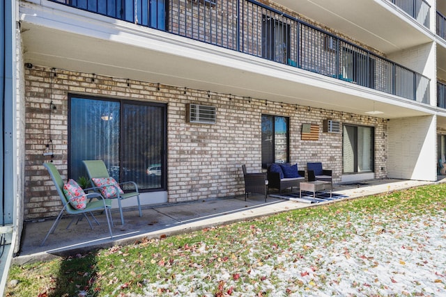 10501 Cedar Lake Rd Unit 217, Minnetonka, MN 55305 - back of house with brick siding, a balcony, and a patio area