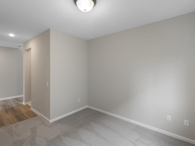 3212 Kady Ave NE, Saint Michael, MN 55376 - carpeted empty room with baseboards and a textured ceiling