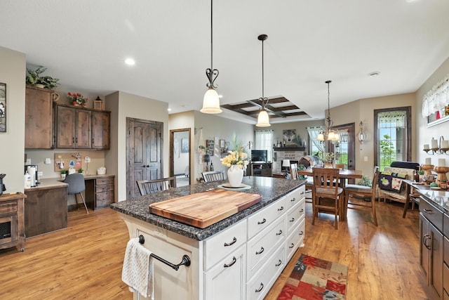 129 Highland Cir, Dassel, MN 55325 - kitchen with light wood-style flooring, open floor plan, a kitchen island, pendant lighting, and recessed lighting