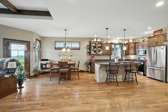 129 Highland Cir, Dassel, MN 55325 - kitchen with stainless steel appliances, a kitchen breakfast bar, recessed lighting, light wood-type flooring, and a kitchen island
