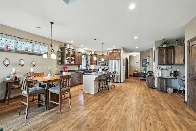 129 Highland Cir, Dassel, MN 55325 - dining room featuring healthy amount of natural light, light wood-style floors, and recessed lighting