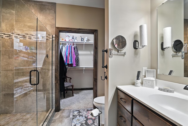 129 Highland Cir, Dassel, MN 55325 - bathroom featuring a stall shower, vanity, and a walk in closet