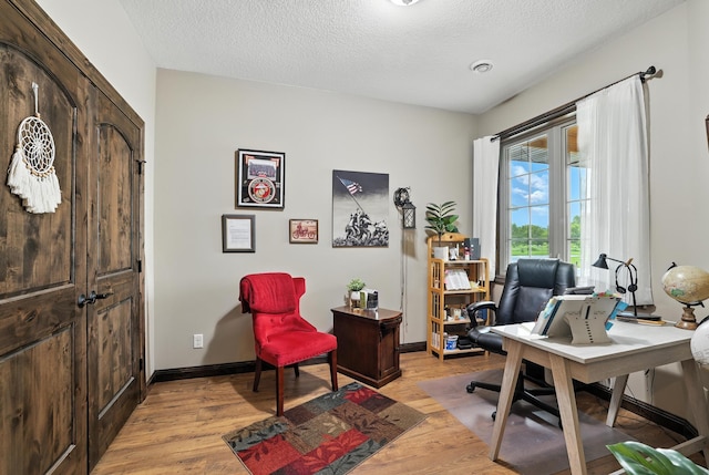 129 Highland Cir, Dassel, MN 55325 - office space with light wood-style flooring and a textured ceiling