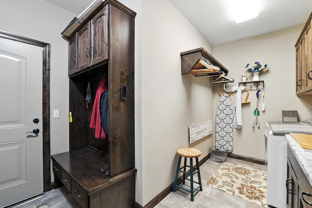 129 Highland Cir, Dassel, MN 55325 - washroom with washer / clothes dryer and a textured ceiling