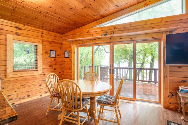 2913 125th St, Island Lake Twp, MN 56651 - dining space with vaulted ceiling, wood walls, wood finished floors, and wood ceiling