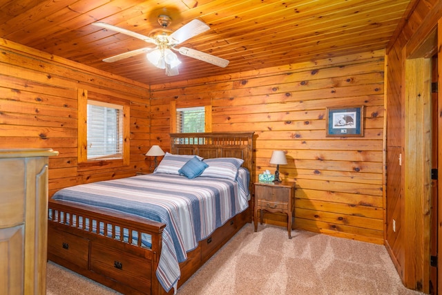 2913 125th St, Island Lake Twp, MN 56651 - carpeted bedroom with wood ceiling, wood walls, and ceiling fan
