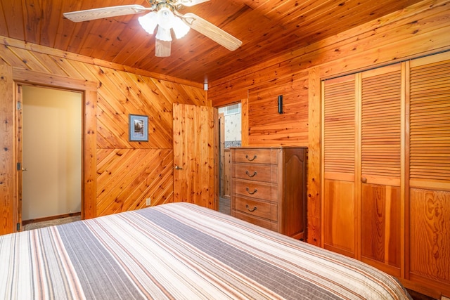 2913 125th St, Island Lake Twp, MN 56651 - bedroom with a closet, wood walls, wood ceiling, and ceiling fan