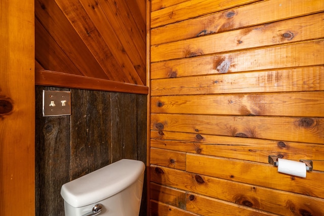 2913 125th St, Island Lake Twp, MN 56651 - bathroom featuring toilet and wood walls